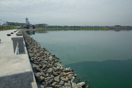 An oval bridge from iron and wood on the edge of the lake . Boyukshor Lake in Baku Azerbaijan . According to geological data, the average depth of the water in the lake is 3.40-3.95 meters .の写真素材