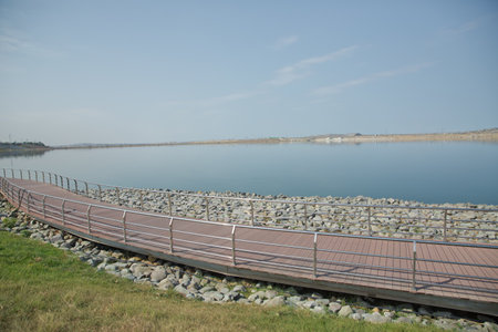 An oval bridge from iron and wood on the edge of the lake . Boyukshor Lake in Baku Azerbaijan . According to geological data, the average depth of the water in the lake is 3.40-3.95 meters .の写真素材