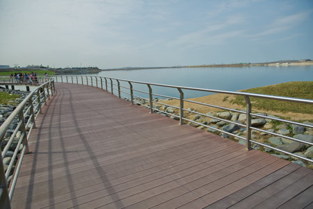 An oval bridge from iron and wood on the edge of the lake . Boyukshor Lake in Baku Azerbaijan . According to geological data, the average depth of the water in the lake is 3.40-3.95 meters .の写真素材