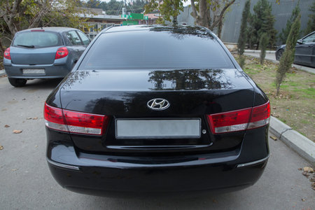 Azerbaijan , Baku . 16.12.2020 . Hyundai Sonata, 2.4 L, 2009 il .Black Car controller on steerling wheel ,Music,Control System Function and voice telephone in car. modern car interior .のeditorial素材