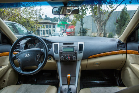 Hyundai Sonata, 2.4 L, 2009 il .Black Car controller on steerling wheel ,Music,Control System Function and voice telephone in car. modern car interior .のeditorial素材