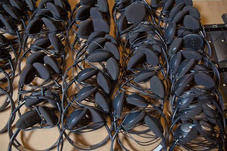 headphones used for simultaneous translation equipment simultaneous interpretation equipment . A set of headphones for simultaneous translation during negotiations in foreign languages.の写真素材