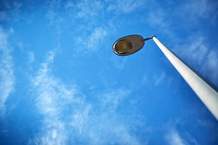 street lamp post with sky . Beautiful summer panoramic view of cloudscape and blue sky . The sky in summer. Street lamp in the blue skyの写真素材
