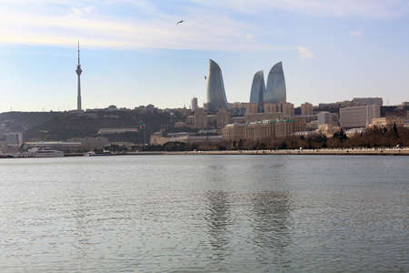 Baku with the Flame Towers skyscrapers, television tower and the seaside of the Caspian sea . View from the Caspian Sea on the Flame Towers skyscrapers in Baku, Azerbaijanのeditorial素材