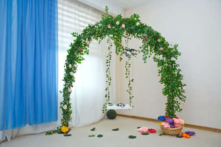 Arch decorated with flowers and leaf at the wedding caremony . arch for the wedding ceremony, decorated cloth, flowers andの写真素材