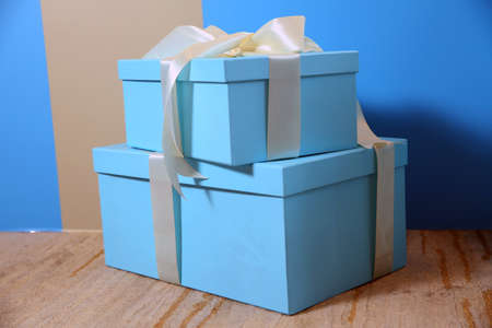 Presents and Gifts under Christmas Tree, in focus. Winter Holiday Concept . sky new year gift . Decorated Christmas room with beautiful fir tree .Christmas and New Year's Day , blue gifts . Blue boxの写真素材
