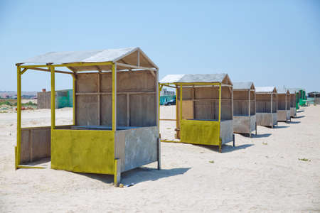 Beach huts . Houses on the beach of Caspian Sea . Summer Background . the seaside . wooden houses by the beach in Caspian Sea . Cabins at the sand beach. Sea sandの写真素材