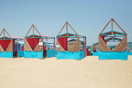 Beach huts . Houses on the beach of Caspian Sea . Summer Background . the seaside . wooden houses by the beach in Caspian Sea . Cabins at the sand beach. Sea sandの写真素材