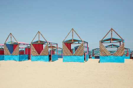 Beach huts . Houses on the beach of Caspian Sea . Summer Background . the seaside . wooden houses by the beach in Caspian Sea . Cabins at the sand beach. Sea sandの写真素材