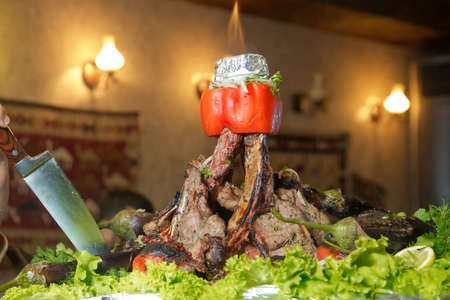 Many Cooking Traditional Azerbaijan asting lamb barbecues.Roasted meat over an open fire, cooked in a special way.Barbecue is prepared of lamb or sheep meat and processed by slasher. Eggplant stuffingの写真素材