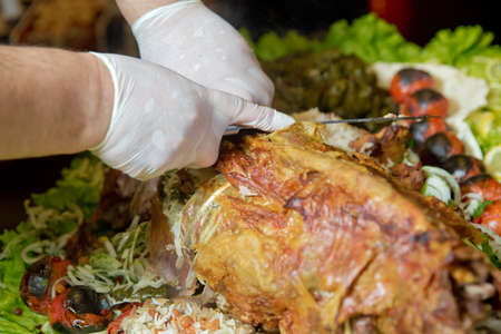 Roasted meat over an open fire, cooked in a special way.Barbecue is prepared of lamb or sheep meat and processed by slasher. pilaf . Many Cooking Traditional Azerbaijan asting lamb barbecues.の写真素材