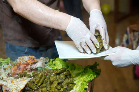 Pour the stuffing into a plate. Barbecue is prepared of lamb or sheep meat and processed by slasher....