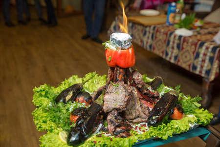 Many Cooking Traditional Azerbaijan asting lamb barbecues.Roasted meat over an open fire, cooked in a special way.Barbecue is prepared of lamb or sheep meat and processed by slasher. Eggplant stuffingの写真素材