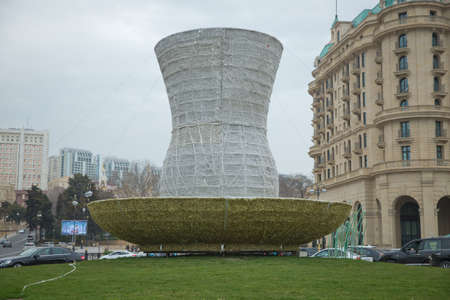 Statue of a large pear glass on Azneft Square Street in Baku . Pear glass statue . Azerbaijan Baku . 31.03.2021 .のeditorial素材