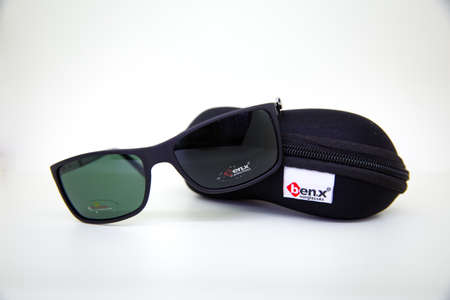 Black glasses on gray isolated white background . BENX MENS SUNGLASSES . Azerbaijan Baku . 24.04.2021 .のeditorial素材