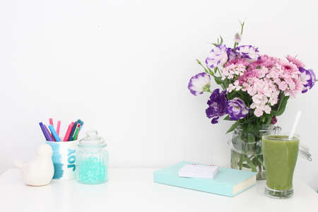 Beautiful Desk With Mint Notebook And Flowers