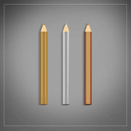 three colored pencils gold, silver, bronzeの写真素材