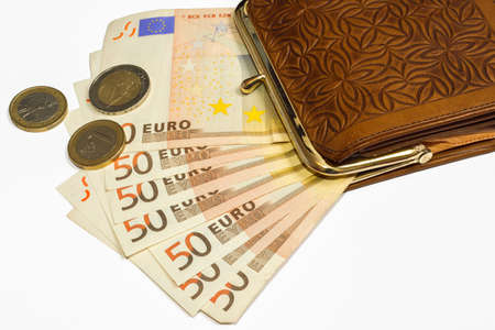 Wallet with money on white background