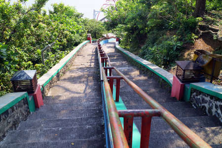 long staircase with iron handrail photo
