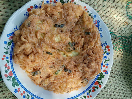 omelet on a white plate seen from above photo