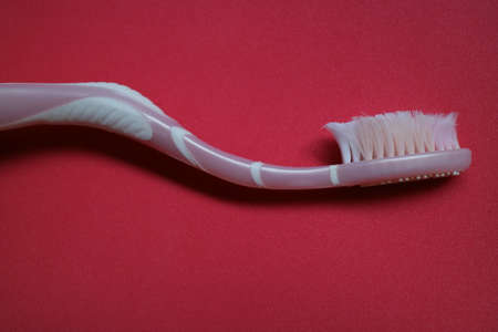 used toothbrush for cleaning teeth on isolated background photo