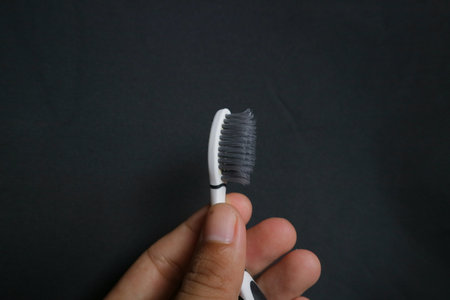 used toothbrush for cleaning teeth on isolated background photoの写真素材