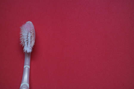 used toothbrush for cleaning teeth on isolated background photoの写真素材
