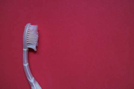 used toothbrush for cleaning teeth on isolated background photo