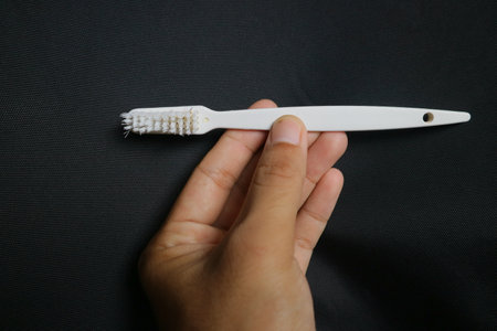 used toothbrush for cleaning teeth on isolated background photoの写真素材