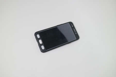 White color of smartphone with black case photo
