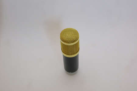 Gold and black color of condenser microphone photoの写真素材
