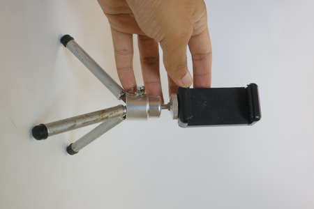 White grey color or mini tripod for camera or smartphone photo