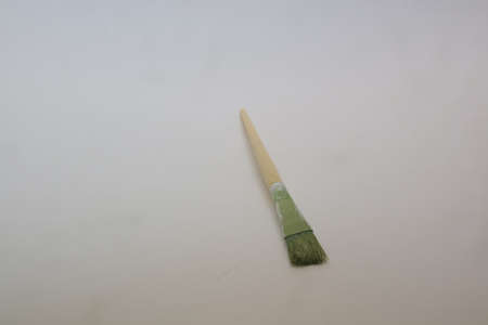 dirty old brush for painting on white isolated background photoの写真素材