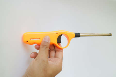 orange color of long neck gas lighter photo
