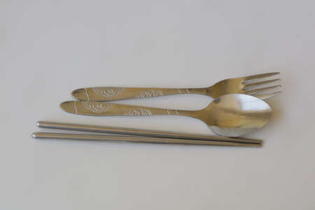 stainless fork and spoon on white isolated background photo
