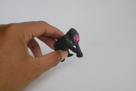 chimpanzee small toy made of plastic photoの写真素材
