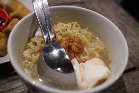 boiled noodles on a white bowl photoの写真素材