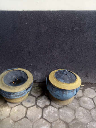 two trash cans made from old rubber tires photoの写真素材