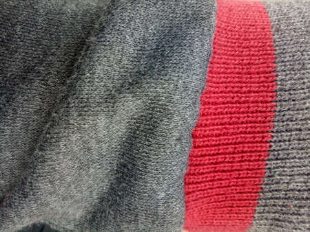 fabric texture of a gray red jacket photoの写真素材