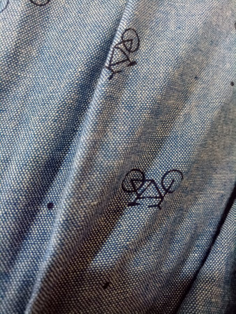 A Photo of a gray cloth texture with a bicycle image