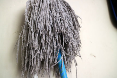 A photo of A mop head for cleaning floors, in worn white colorの写真素材