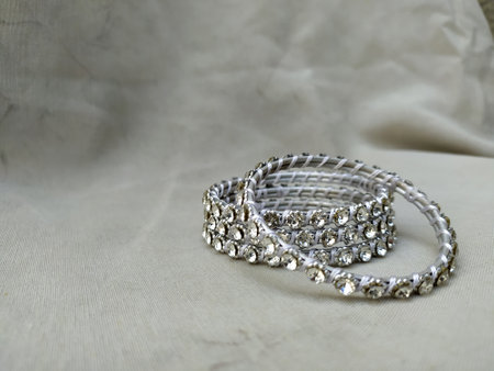 Photo of Beautiful white silver bracelet with pearl ornamentsの写真素材