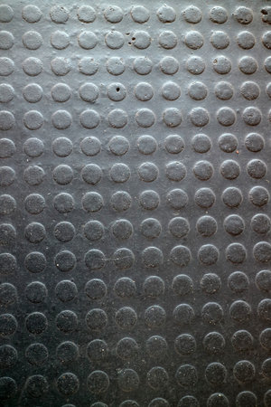 Close up of a textured rubber mat with circular patterns