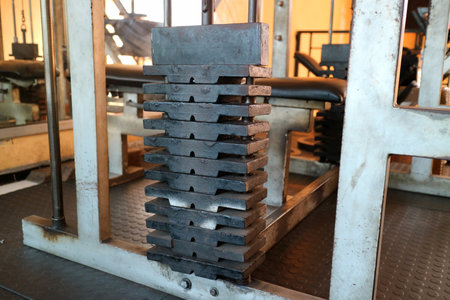 Close up of a stack of weight plates on a gym machine in a fitness center.の写真素材