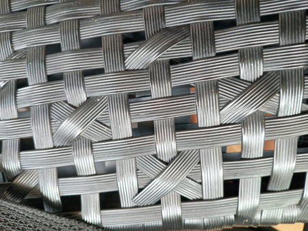 Close up of interwoven gray plastic rattan wicker pattern, textured woven background suitable for...
