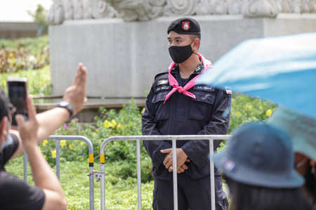 Bangkok, THAILAND - October 14, 2020: Riot police stand guard in Democracy Monument during a Thai anti-government mass protest, on the 47th anniversary of the 1973 student uprising.のeditorial素材