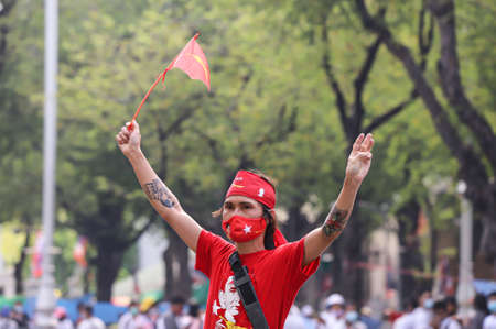 Bangkok, THAILAND - February 7, 2021: Myanmar protesters a three finger salute to show symbolic gestures at Ratchadamnoen Nok Rd. to protest against the military coup and free Aung San Suu Kyi.のeditorial素材