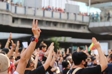 Bangkok, THAILAND - February 10, 2021: Pro-Democracy protesters protest at Pathumwan Intersection to hit the pot after the protesters not bailed out by the court the lese majeste case.のeditorial素材