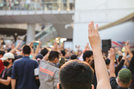Bangkok, THAILAND - February 10, 2021: Pro-Democracy protesters protest at Pathumwan Intersection to hit the pot after the protesters not bailed out by the court the lese majeste case.のeditorial素材