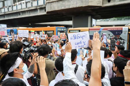 Bangkok, THAILAND - February 10, 2021: Myanmar protesters joined thai protesters protest at Pathumwan Intersection to hit the pot for against the military coup and free Aung San Suu Kyi.のeditorial素材